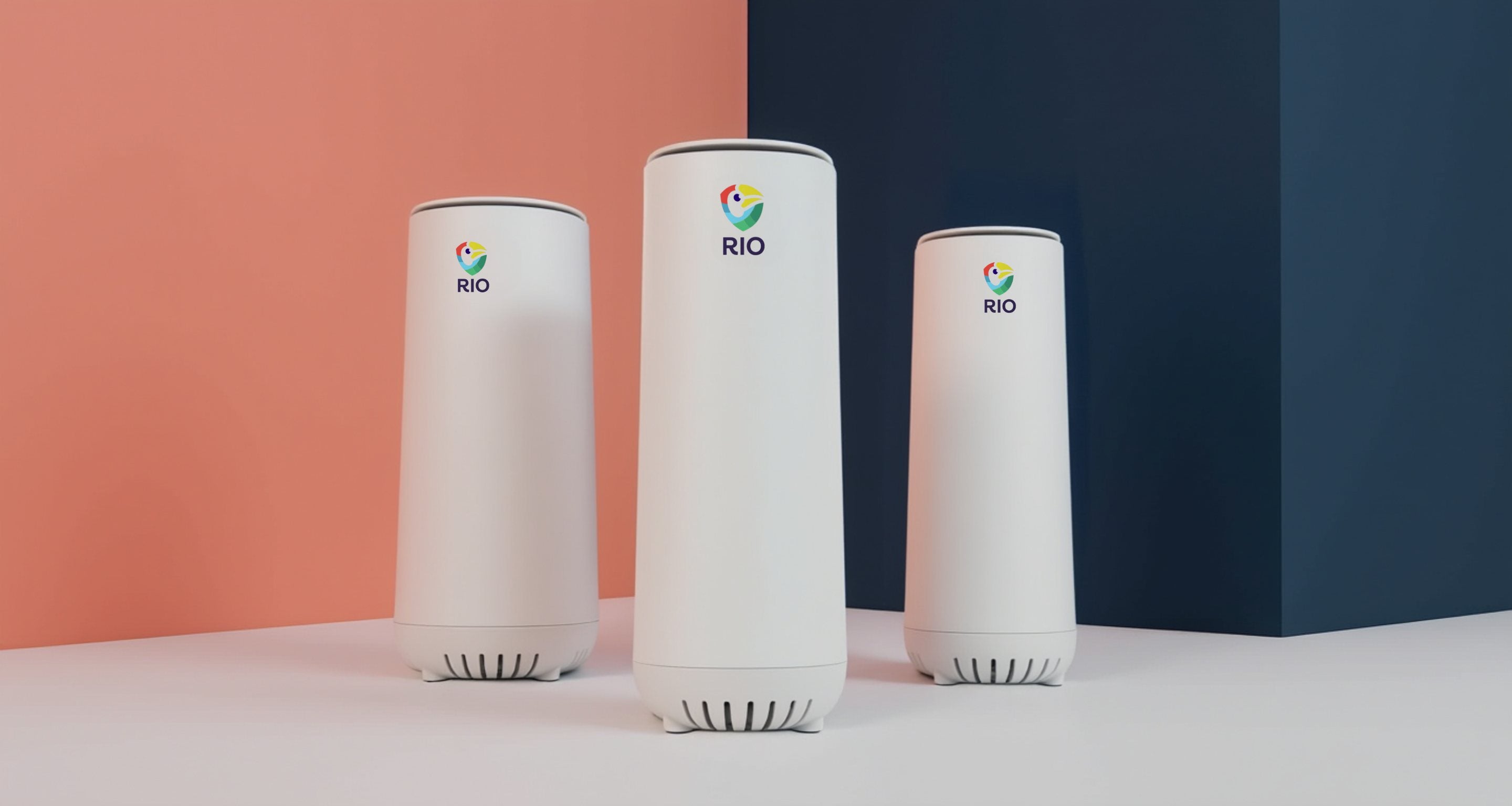 Three Rio routers against a coral and navy wall